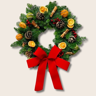 Traditional fresh foliage door wreath with pinecones, cinnamon and fruit slices all finished with a luxury red velvet bow. 