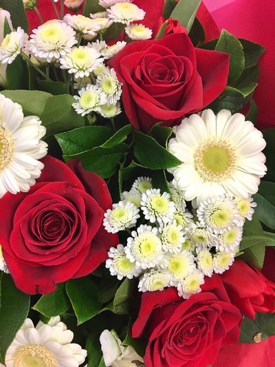 Red and white romantic flower bouquet, hand-tied and gift wrapped.