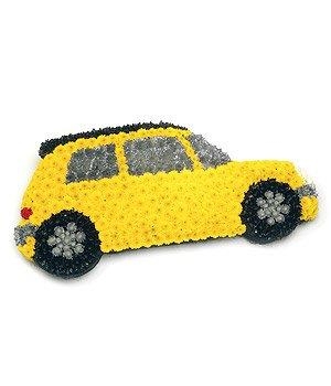 Car-shaped funeral tribute made with coloured chrysanthemum and spray-paint detailing, measuring approximately 45cm x 90cm, available in a range of colour options.
