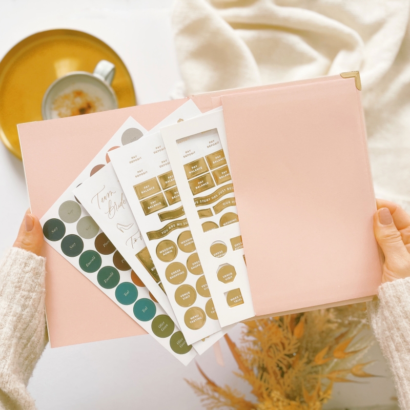 Blush & Gold Blush wedding planner with soft blush pink cover and gold detailing.