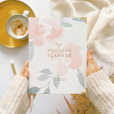 Blush & Gold Floral wedding planner with pastel floral cover and gold detailing.