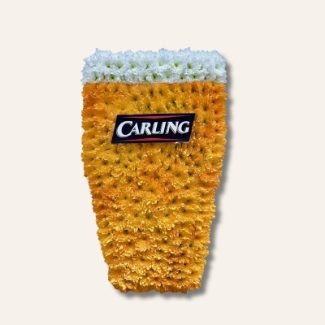 Carling pint funeral tribute made with sprayed chrysanthemums and a laminated carling logo, 24 x 12 inches.