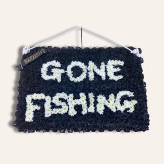 Gone Fishing funeral tribute designed as a hanging sign made with sprayed chrysanthemum on an oasis sheet, finished with rope hanger, measuring approximately 24 inches by 36 inches.