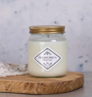 The Naked Candle Co Wild Fig & Cassis soy candle with fig, cassis, pine and cedarwood fragrance notes.