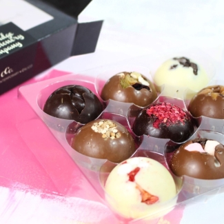 Cambridge Confectionery Company 9 Dome Gift Box featuring assorted solid chocolate domes in multiple flavours.