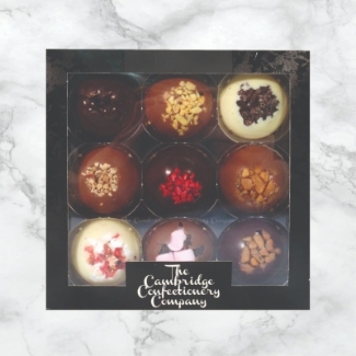 Cambridge Confectionery Company 9 Dome Gift Box featuring assorted solid chocolate domes in multiple flavours.