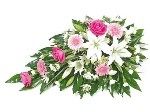 Single-ended spray with soft pink and white seasonal flowers.