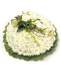White chrysanthemum funeral posy with a foliage edge and a classic spray of white flowers. Customizable colour options available.